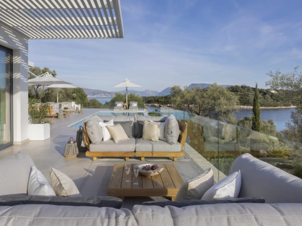 The main al fresco sitting area is furnished with quality, well-cushioned sofas.